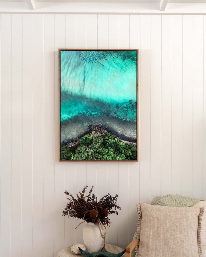 Don’t Dream It’s Over – Cape Tribulation, Aerial Photography by David Lloyd, framed canvas print in oak float frame, styled in a bedroom setting
