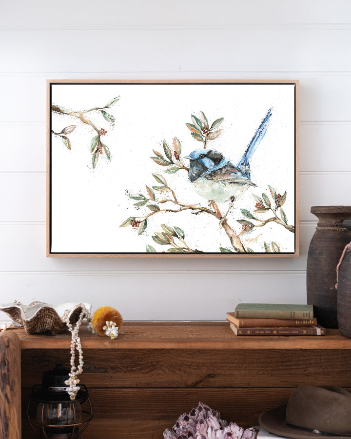 Fairy Floss fairy wren fine art print by Stephanie Elizabeth, framed canvas in an oak frame above a bookshelf