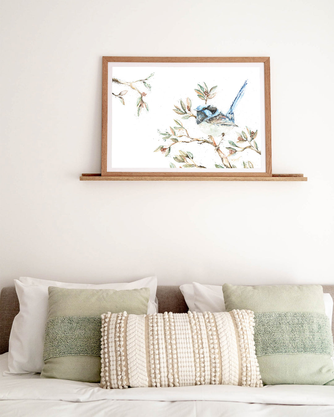 Fairy Floss fairy wren fine art print by Stephanie Elizabeth, framed paper print in an oak frame in a bedroom