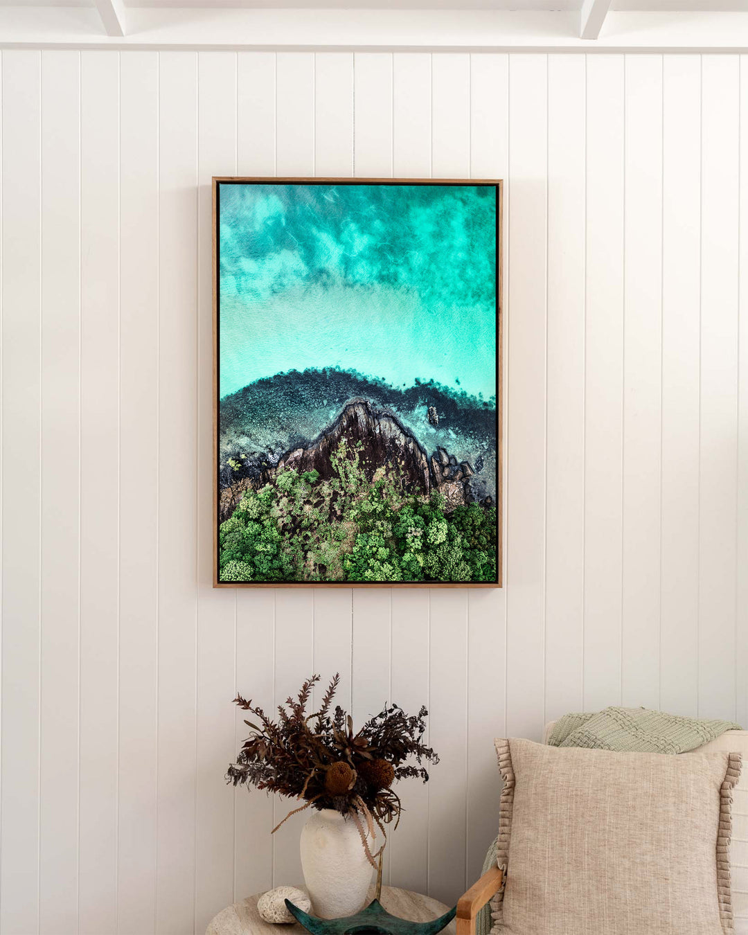Fall At Your Feet – Cape Tribulation, Aerial Photography by David Lloyd, framed canvas print in oak float frame, styled in a bedroom setting