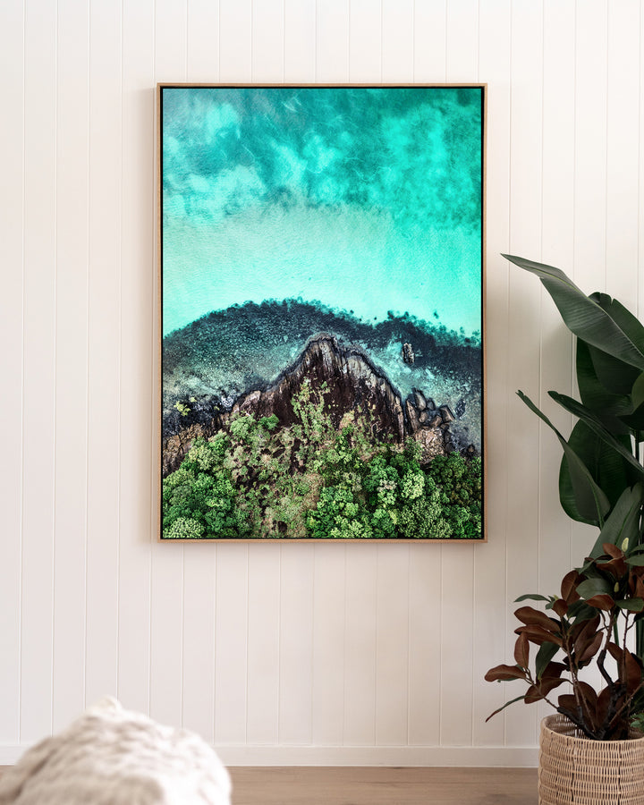 Fall At Your Feet – Cape Tribulation, Aerial Photography by David Lloyd, framed canvas print in oak float frame, styled in a living room setting