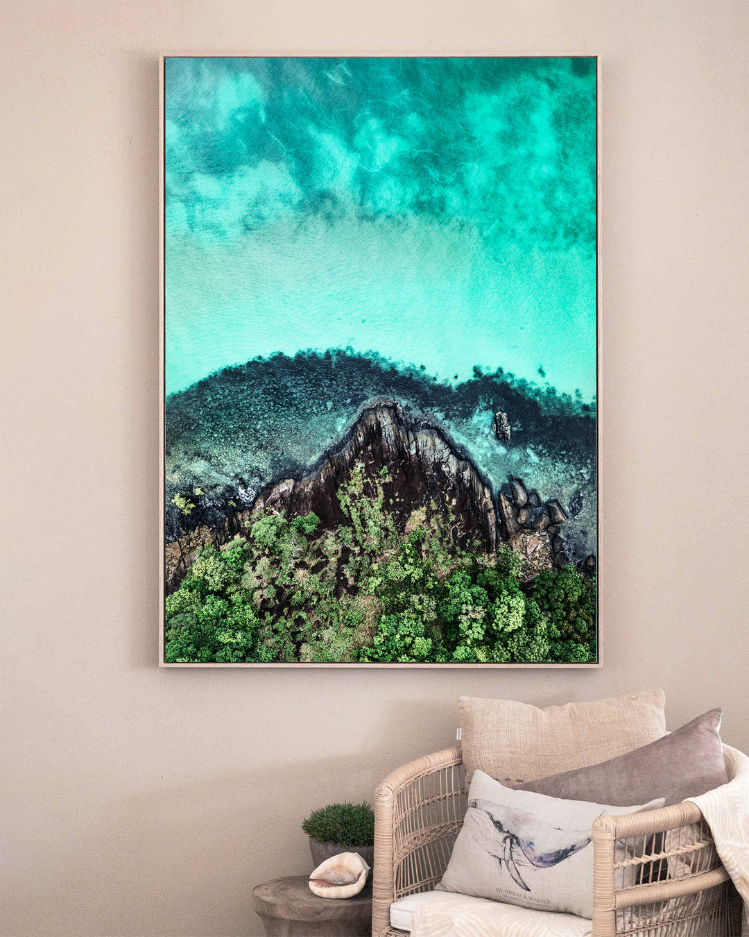 Fall At Your Feet – Cape Tribulation, Aerial Photography by David Lloyd, framed canvas print in oak float frame, styled in a sitting room setting