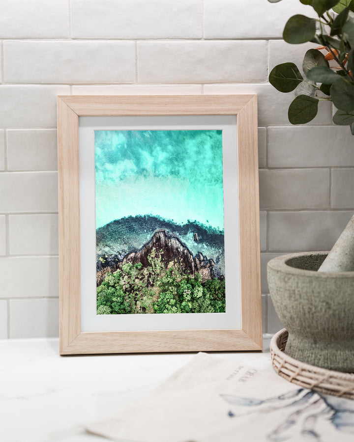 Fall At Your Feet – Cape Tribulation, Aerial Photography by David Lloyd, framed paper print in oak frame, styled in a kitchen bench setting