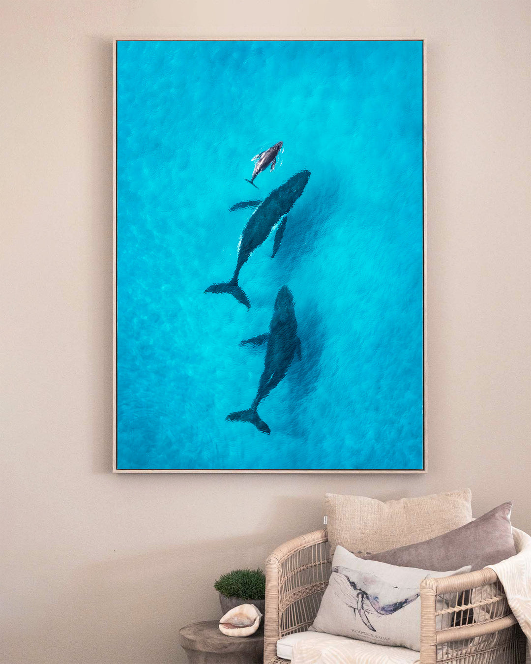 Family Time – Whales, Aerial Photography by David Lloyd, framed canvas print in oak float frame, styled in a sitting room setting