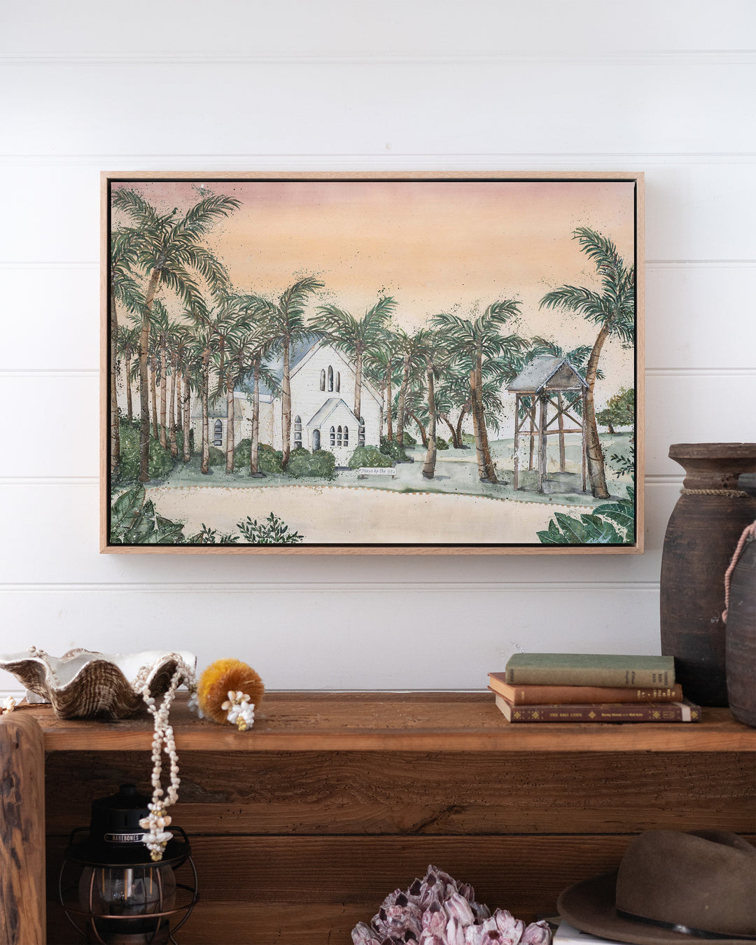 Far Northern Skies – Port Douglas landscape, framed canvas in oak float frame, styled above a timber console