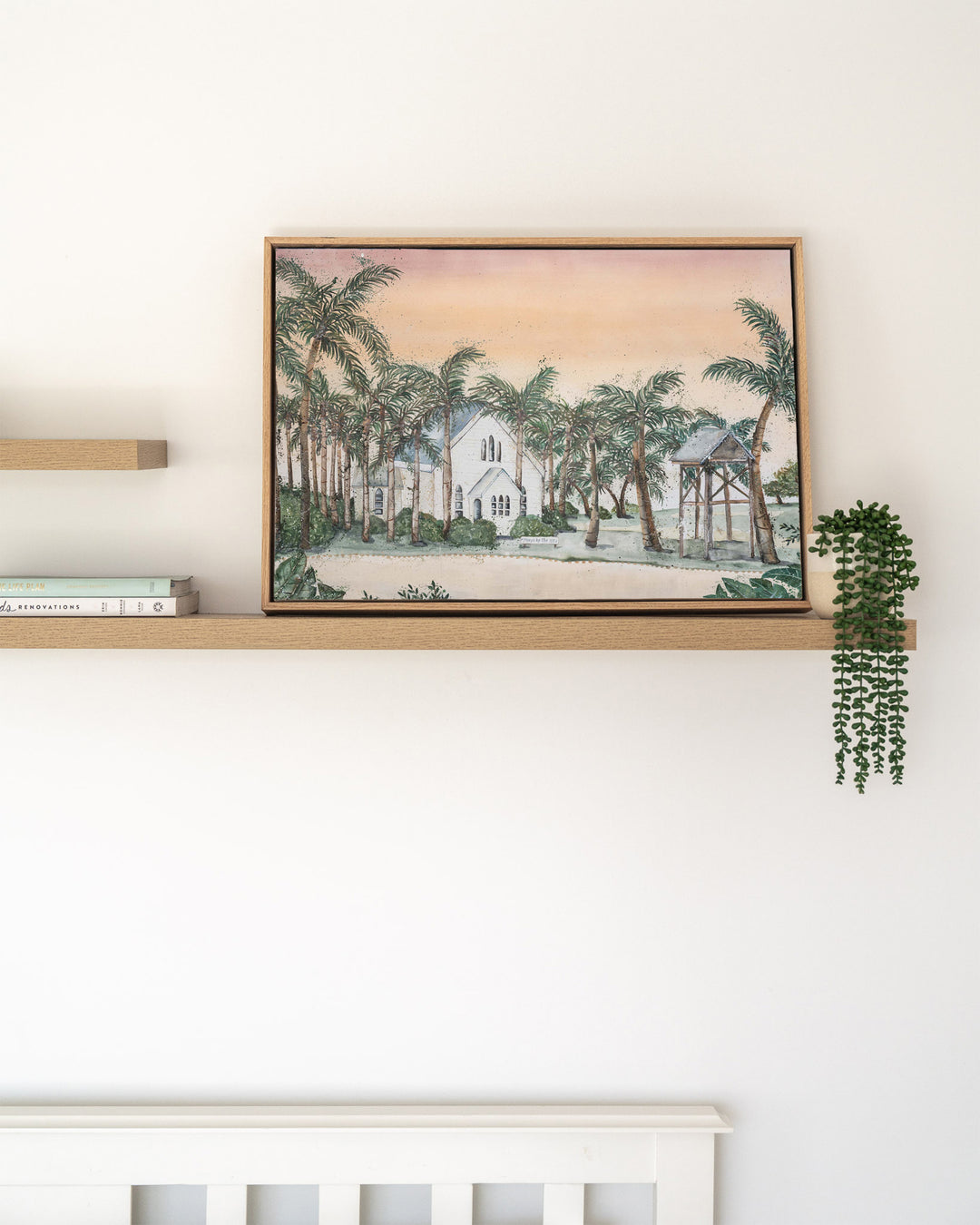 Far Northern Skies – Port Douglas landscape, framed canvas in oak float frame, styled on a floating shelf
