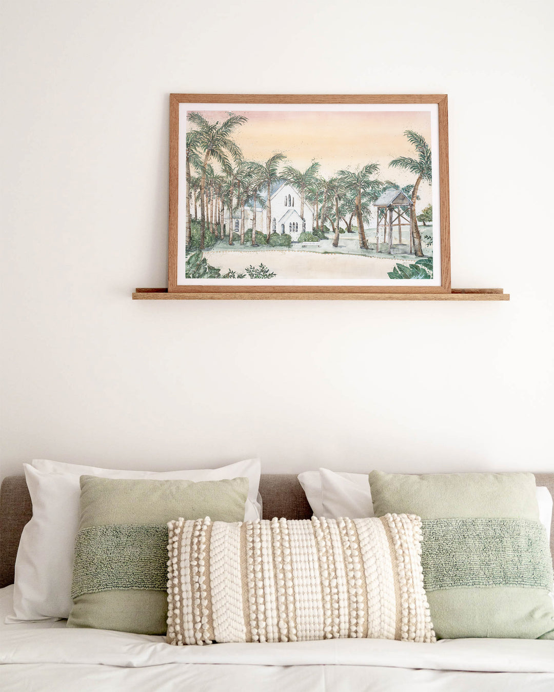 Far Northern Skies – Port Douglas landscape, framed paper print in oak frame, styled above a bed