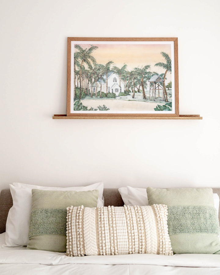 Far Northern Skies – Port Douglas landscape, framed paper print in oak frame, styled above a bed