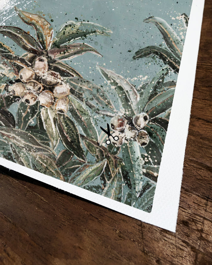 Corner of a fine art canvas print resting on a timber surface, showing a white cockatoo&