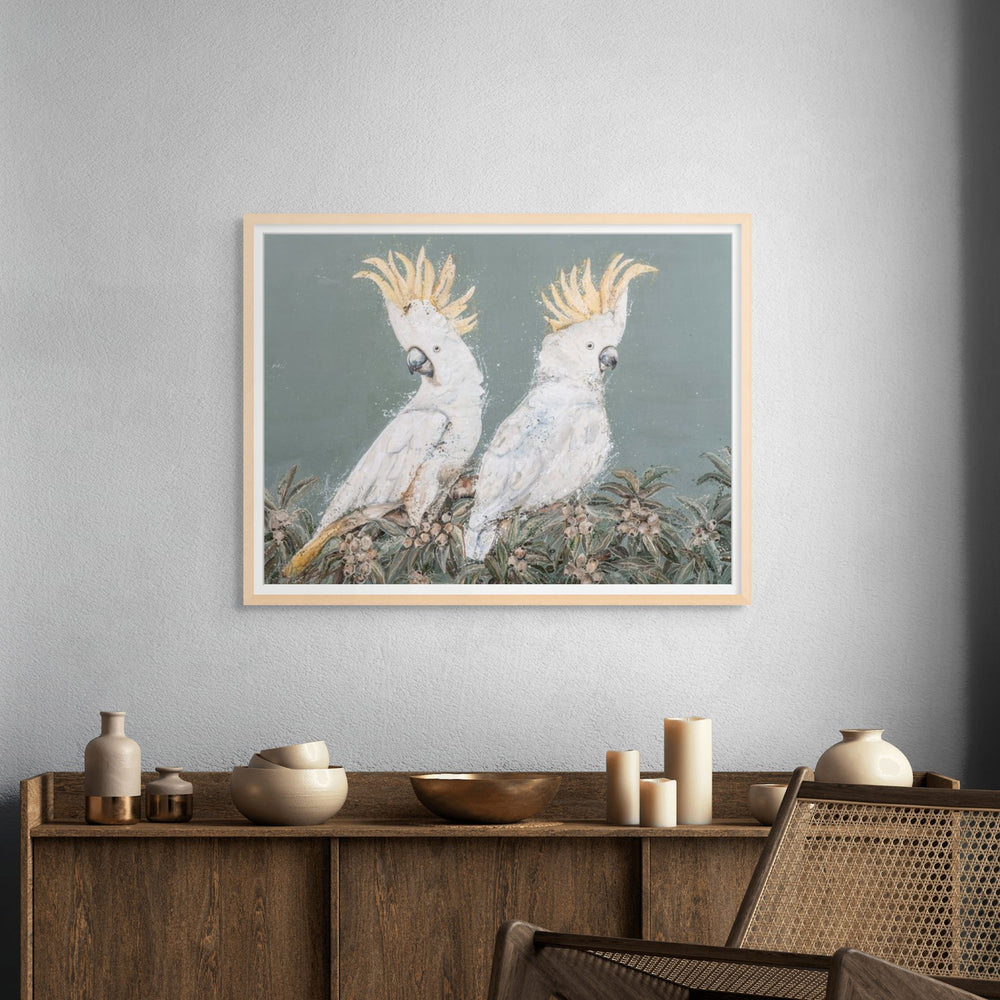 Framed presentation of Feathers and Mayhem by Stephanie Elizabeth displayed in a modern interior.