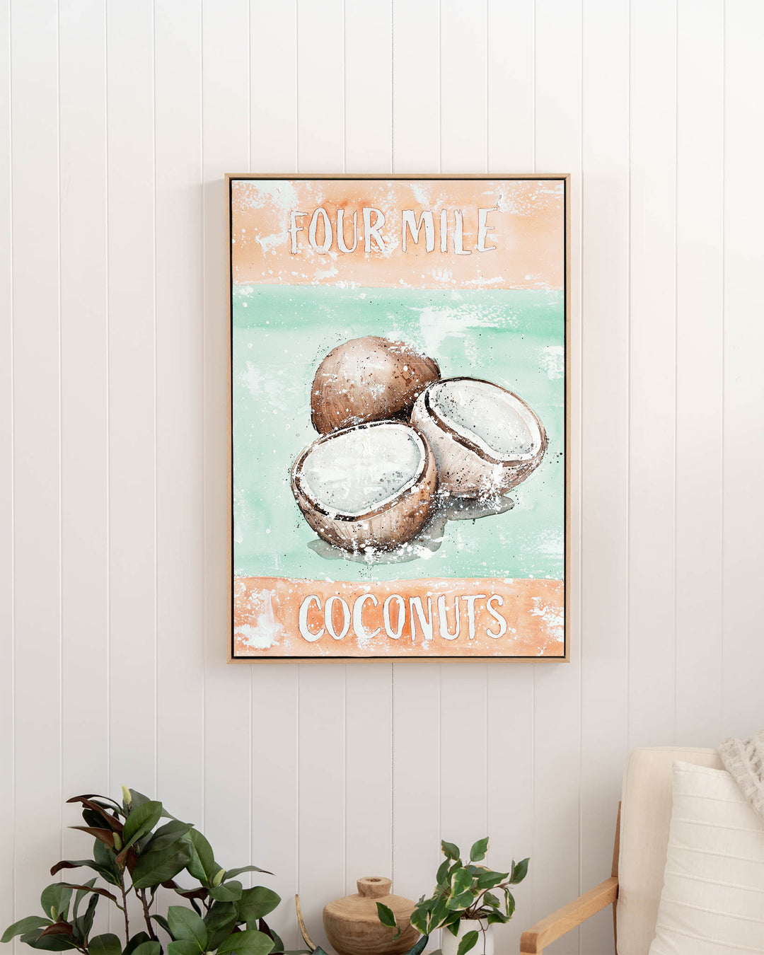 Four Mile Coconuts – tropical still life of coconuts, framed canvas in oak float frame, styled in a hallway
