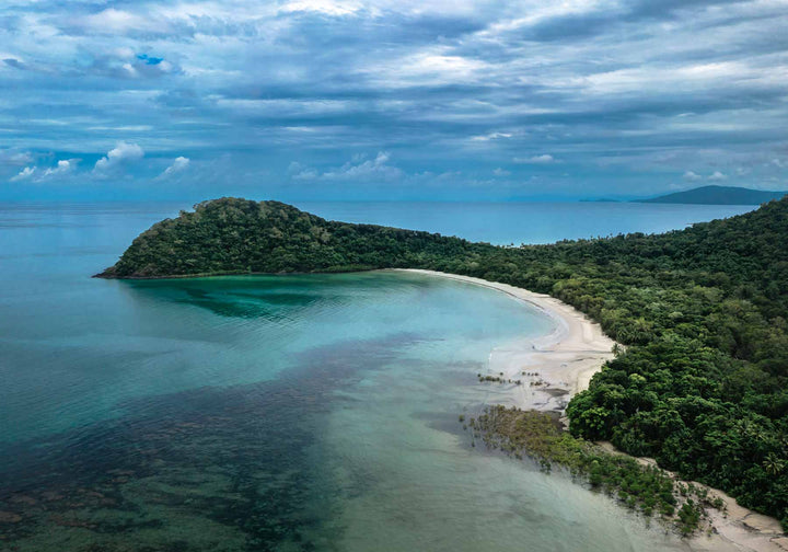 Four Seasons in One Day – Aerial view of Cape Tribulation with deep blue clouds, reef, and coastline | Unframed Rolled Print by David Lloyd