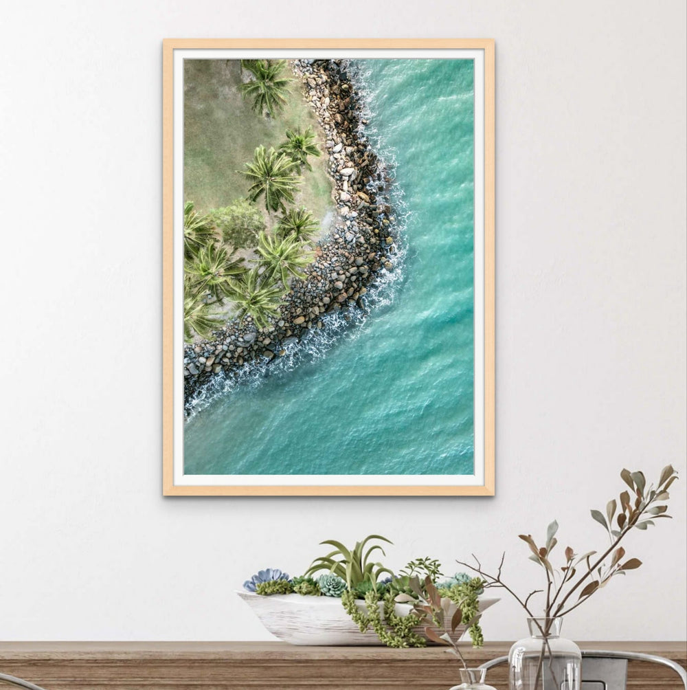 From the Ocean to the Treetops – Aerial photograph of Rex Smeal Park in Port Douglas with golden hour light over ocean, trees and rocks | Framed Paper Print