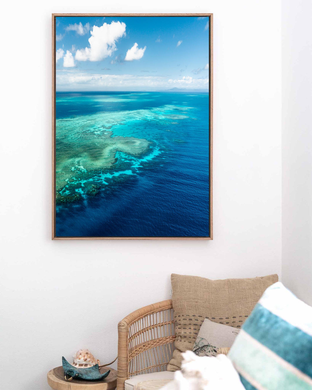 Always Take The Weather With You, Rudder Reef: aerial view of coral reef shallows transitioning into deep blue water.