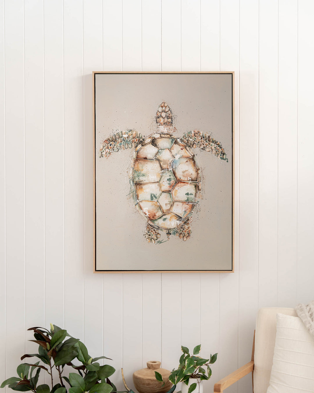 Green sea turtle fine art print by Stephanie Elizabeth, framed canvas in an oak frame in a hallway