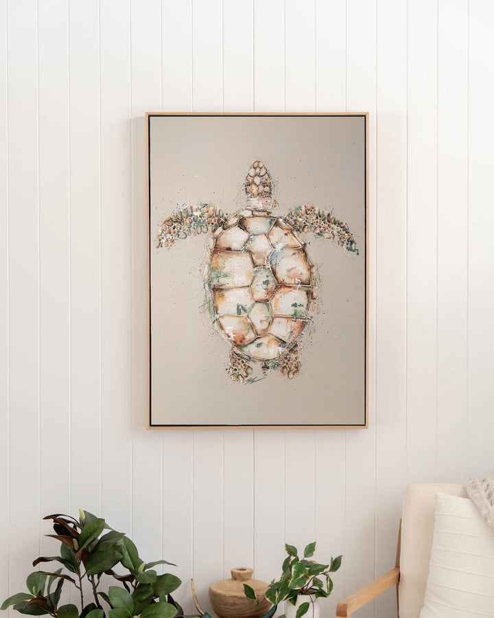 Green sea turtle fine art print by Stephanie Elizabeth, framed canvas in an oak frame in a hallway