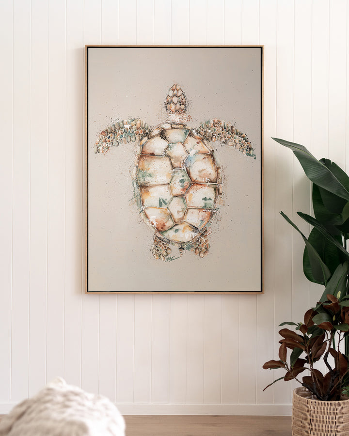 Green sea turtle fine art print by Stephanie Elizabeth, framed canvas in an oak frame in a living room