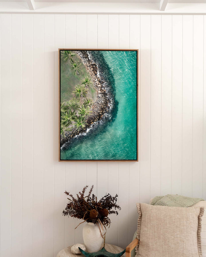 Hammocks and Hangouts – Rex Smeal, Port Douglas, Aerial Photography by David Lloyd, framed canvas print in oak float frame, styled in a bedroom setting