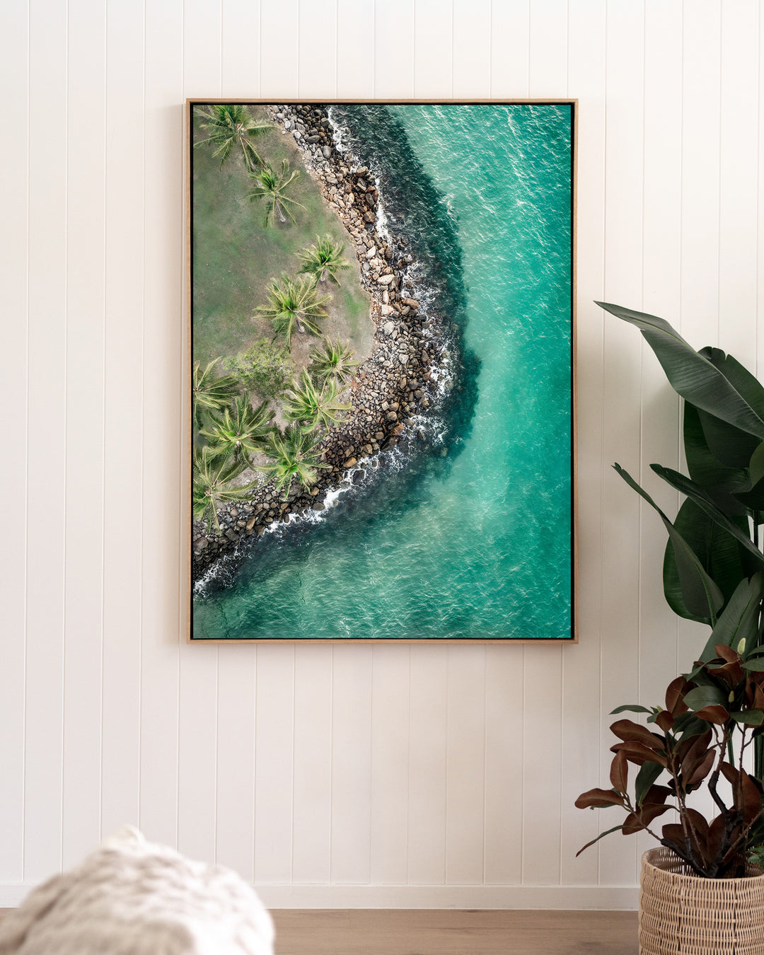 Hammocks and Hangouts – Rex Smeal, Port Douglas, Aerial Photography by David Lloyd, framed canvas print in oak float frame, styled in a living room setting