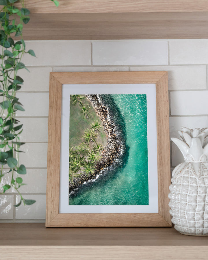 Hammocks and Hangouts – Rex Smeal, Port Douglas, Aerial Photography by David Lloyd, framed paper print in oak frame, styled in a kitchen shelf setting