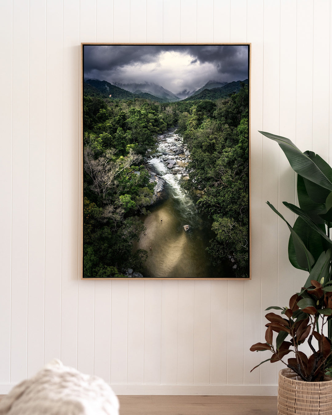 Hazy Habits – Mossman Gorge, Aerial Photography by David Lloyd, framed canvas print in oak float frame, styled in a living room setting