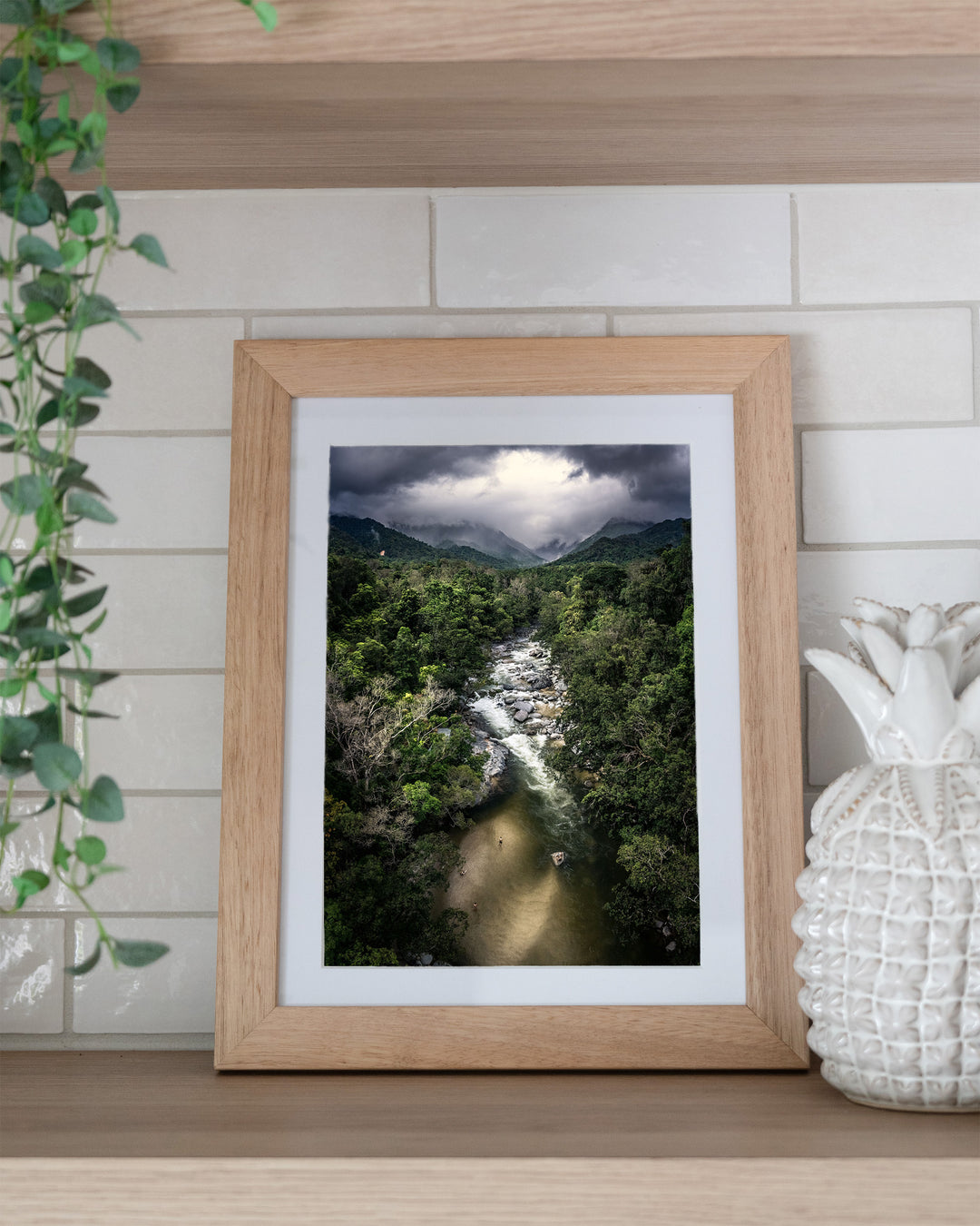 Hazy Habits – Mossman Gorge, Aerial Photography by David Lloyd, framed paper print in oak frame, styled in a kitchen shelf setting