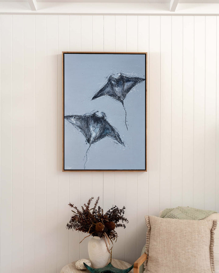 Heart Beats Slow manta rays fine art print by Stephanie Elizabeth, framed canvas in an oak frame in a bedroom