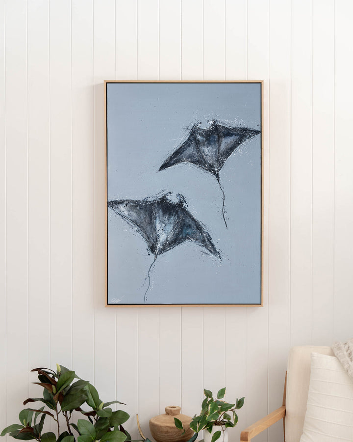 Heart Beats Slow manta rays fine art print by Stephanie Elizabeth, framed canvas in an oak frame in a hallway