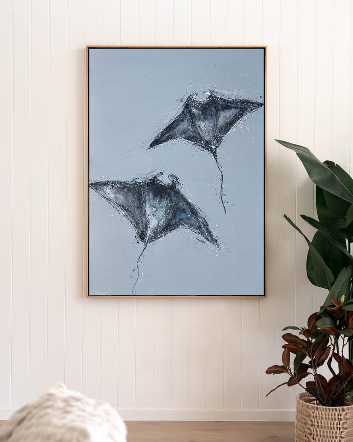 Heart Beats Slow manta rays fine art print by Stephanie Elizabeth, framed canvas in an oak frame in a living room