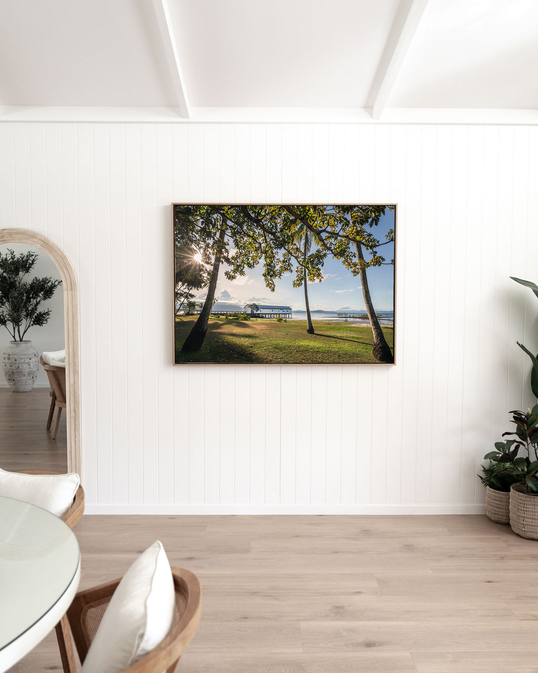 It's Five O'Clock Somewhere – Port Douglas, Landscape Photography by David Lloyd, framed canvas print in oak float frame, styled in a dining room setting