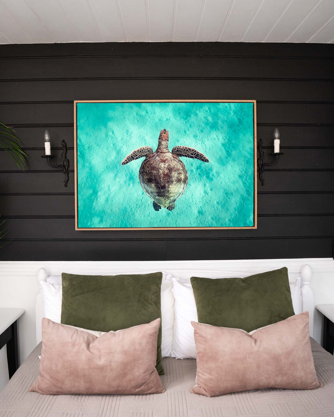Just Breathe – Green Sea Turtle, Underwater Photography by David Lloyd, framed canvas print in oak float frame, styled in a bedroom setting