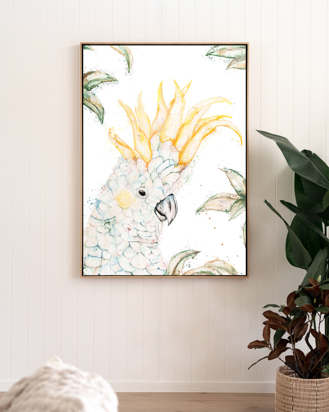 Lemon Sorbet – white cockatoo, framed canvas in oak float frame, styled in a living room