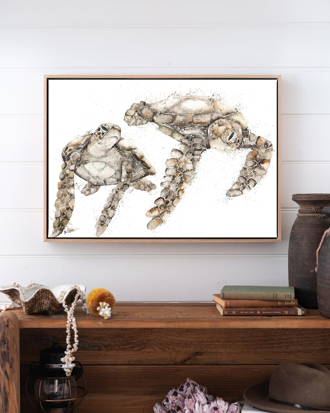 Life by Your Side – green sea turtles, framed canvas in oak float frame, styled above a timber console