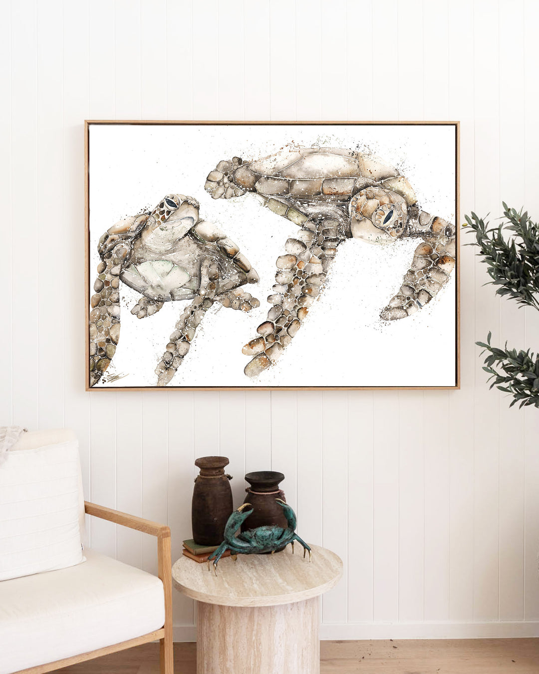 Life by Your Side green sea turtles fine art print by Stephanie Elizabeth, framed canvas in an oak frame in a living room