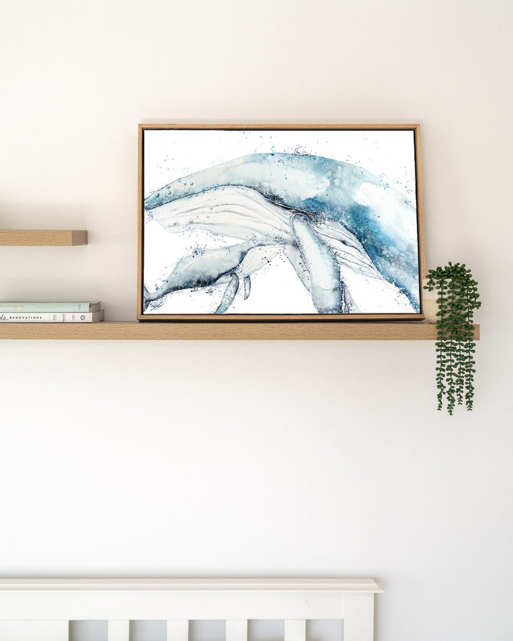 Long Days, Short Years – humpback whale mother and calf, framed canvas in oak float frame, styled on a floating shelf