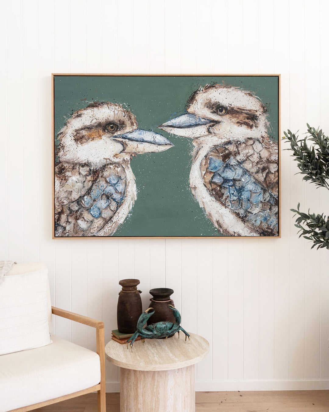 Love Me Now – kookaburras, framed canvas in oak float frame, styled in a living room