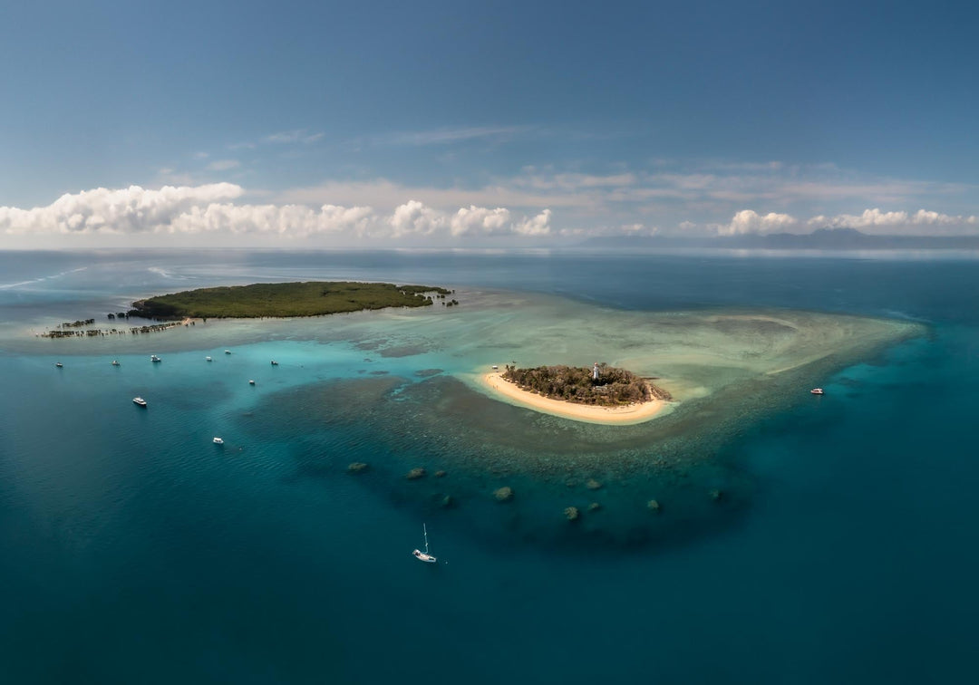 Low Isles Glass Out – Aerial view over Low Isles with vibrant turquoise reef waters on a calm, glassy day | Unframed Rolled Print