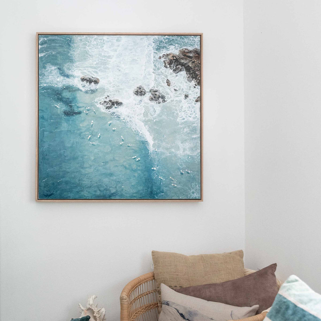 Meet Me at the Pass – Byron Bay surf artwork featuring waves breaking over rocks with surfers waiting in blue water styled in coastal interior | Original Artwork