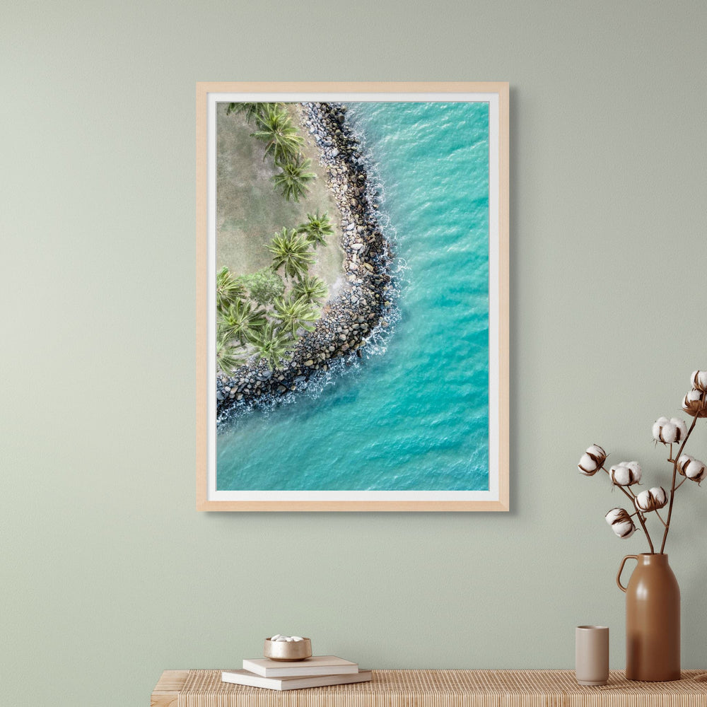 Meet Me Under The Palms – Aerial view of palm trees lining Four Mile Beach in Port Douglas, with turquoise ocean and soft waves | Framed Paper Print