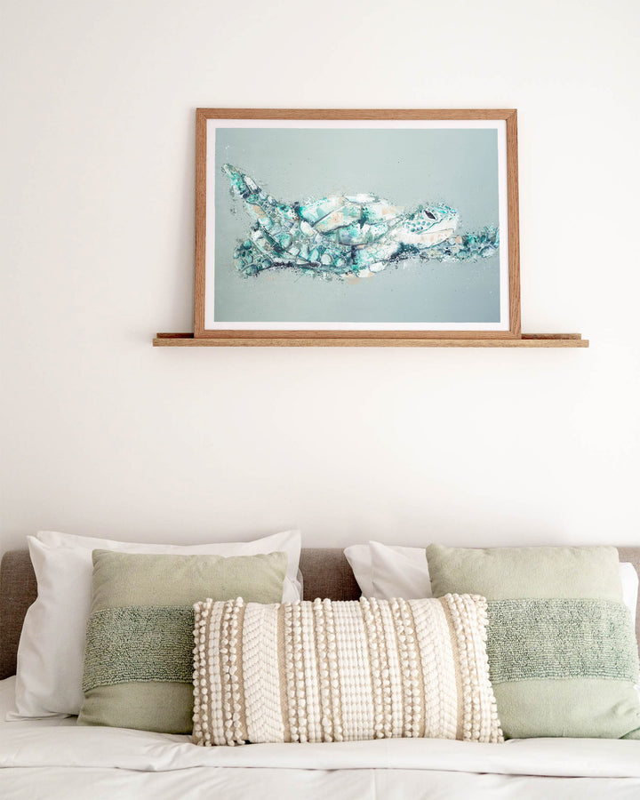 Message in a Bottle green sea turtle fine art print by Stephanie Elizabeth, framed paper print in an oak frame in a bedroom
