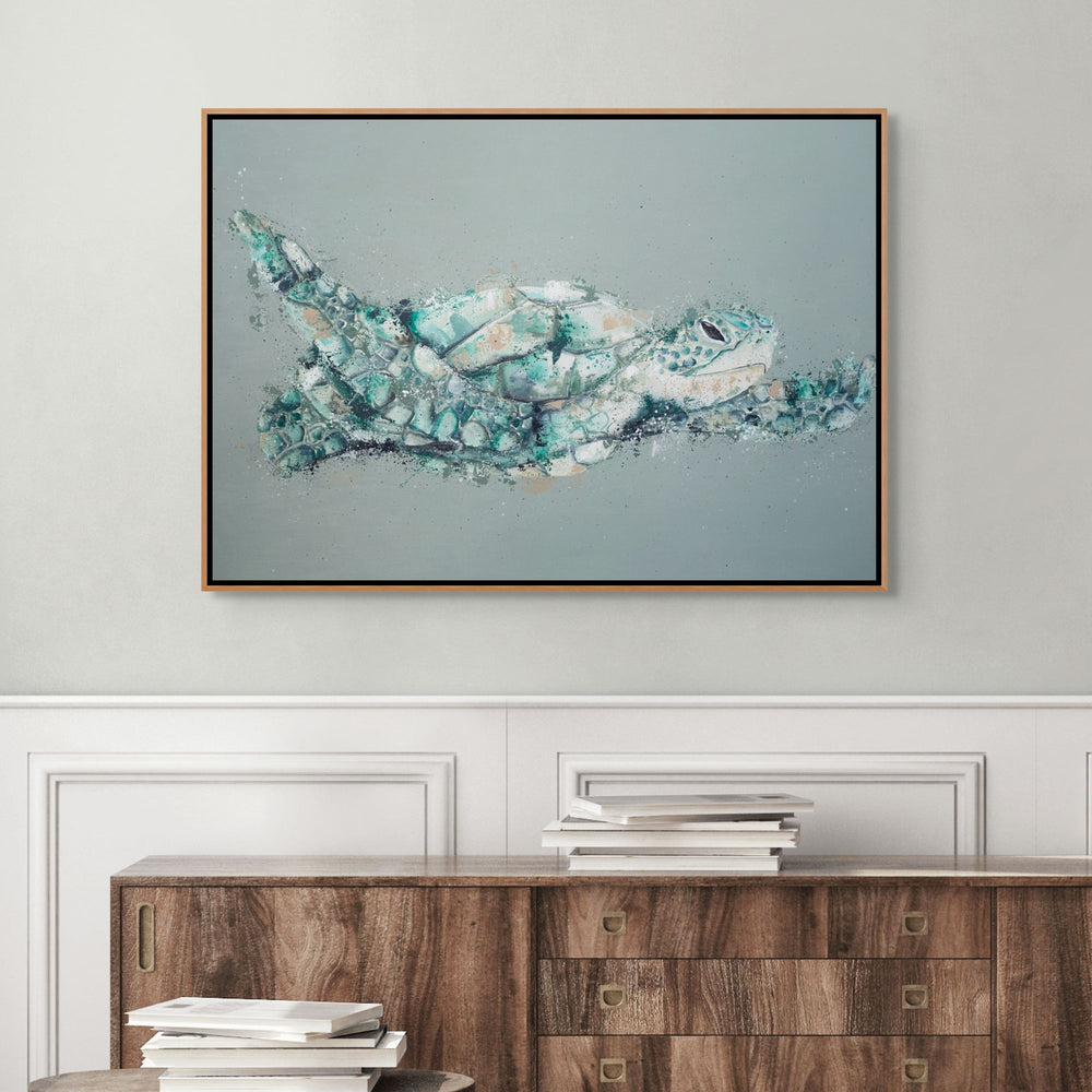 Message in a Bottle by Stephanie Elizabeth – shadow box canvas print featuring green turtle flying over green/teal ocean-inspired background, fine art marine life artwork