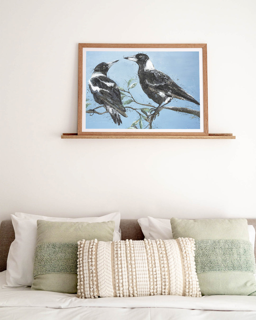 Monochrome Muses – magpies, framed paper print in oak frame, styled above a bed