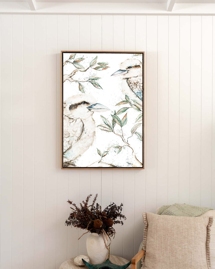Morning Chatter – kookaburras, framed canvas in oak float frame, styled in a bedroom