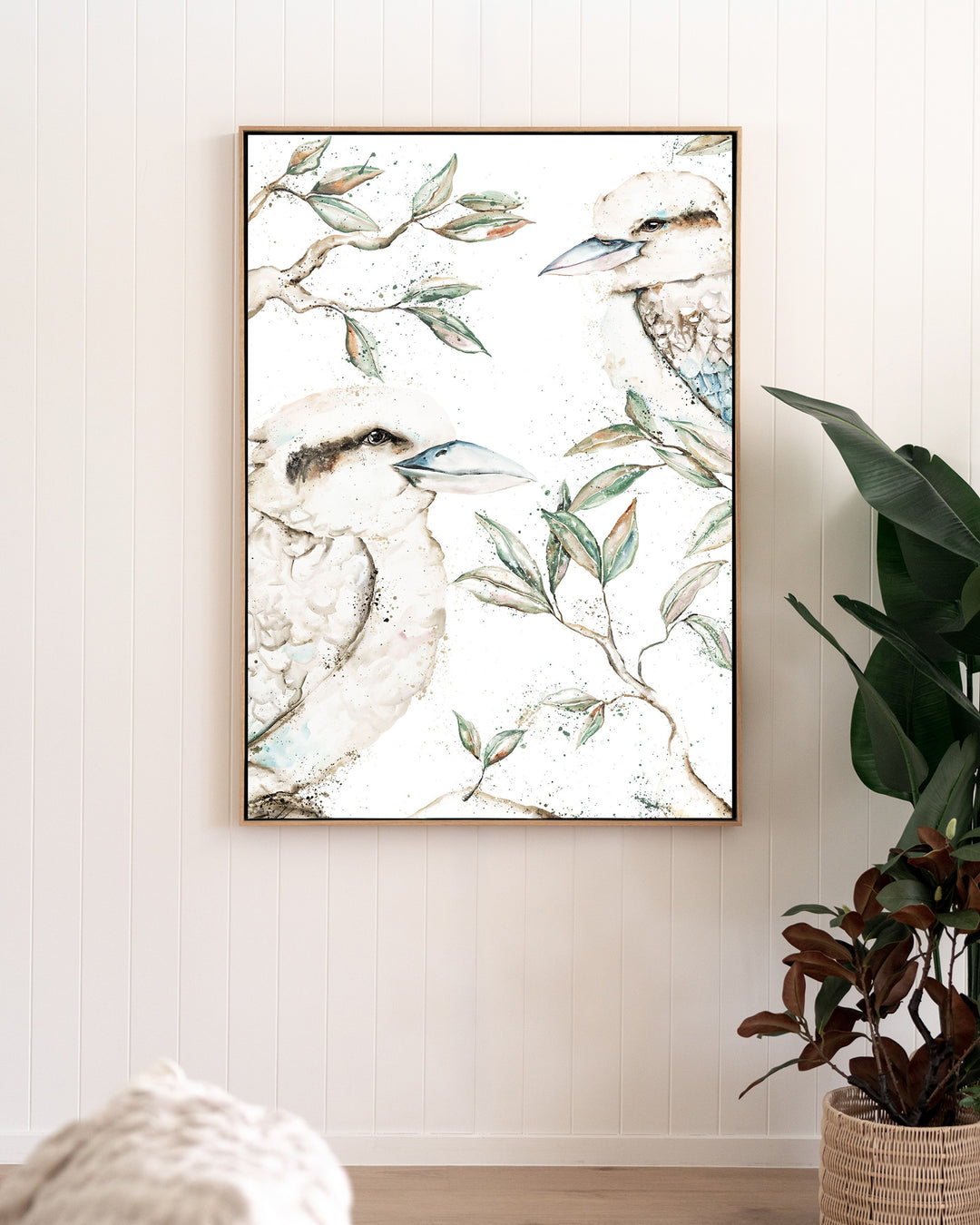 Morning Chatter – kookaburras, framed canvas in oak float frame, styled in a living room