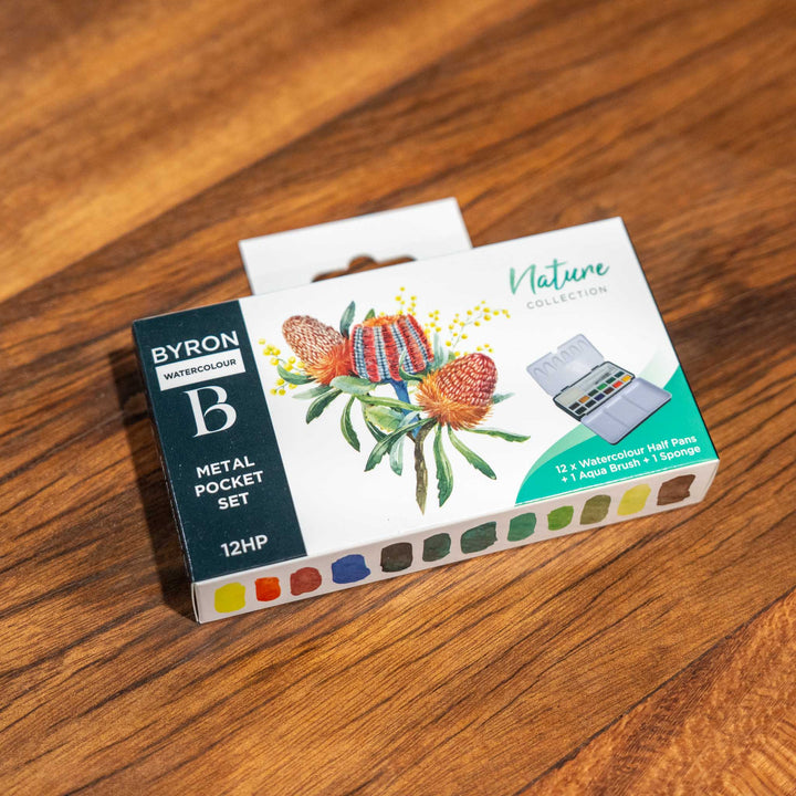 SEA Gallery Nature Watercolour Pocket Set with 12 half pans displayed on a wooden surface.