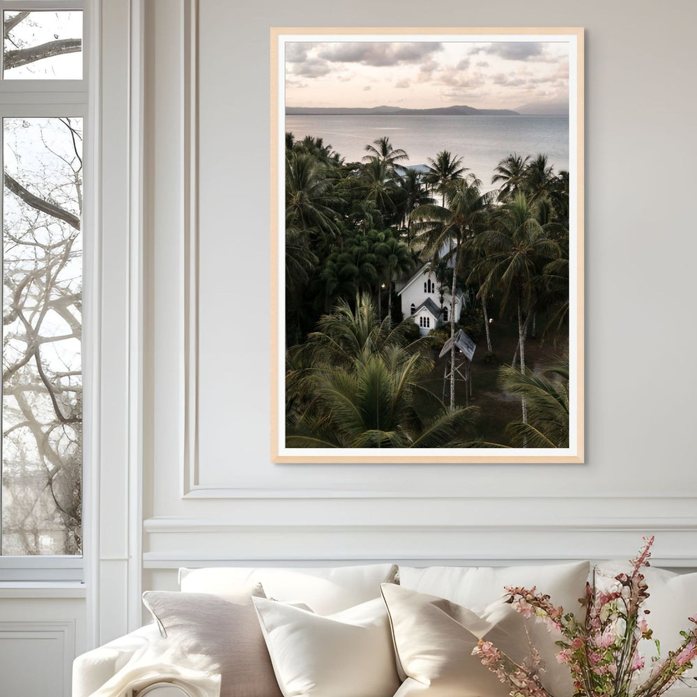 Nestled Amongst The Palms – Aerial photograph of St Mary’s Chapel in Port Douglas surrounded by palms, sunset sky and mountain backdrop | Framed Paper Print