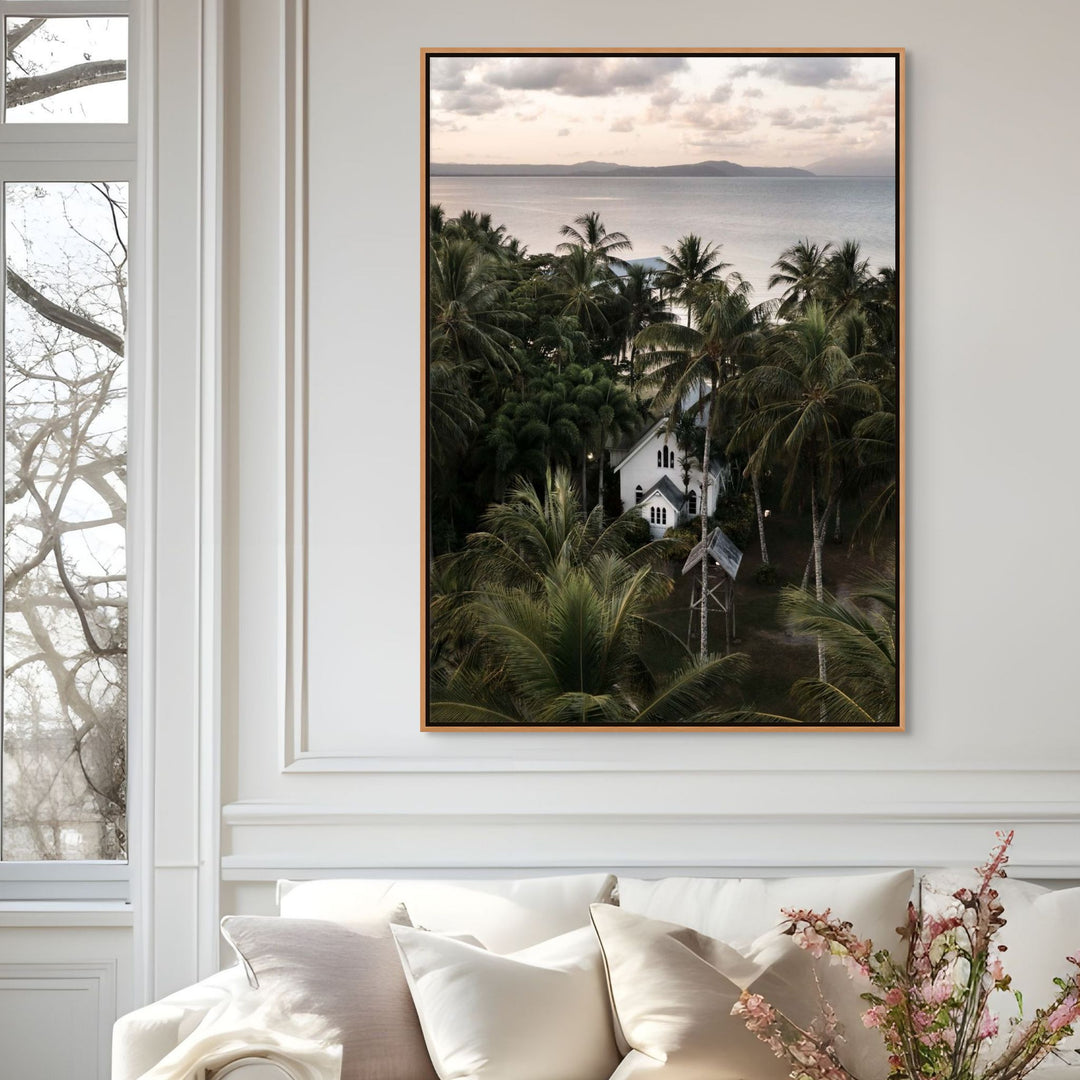 Nestled Amongst The Palms – Aerial photograph of St Mary’s Chapel in Port Douglas surrounded by palms, sunset sky and mountain backdrop | Shadow Box Canvas Print
