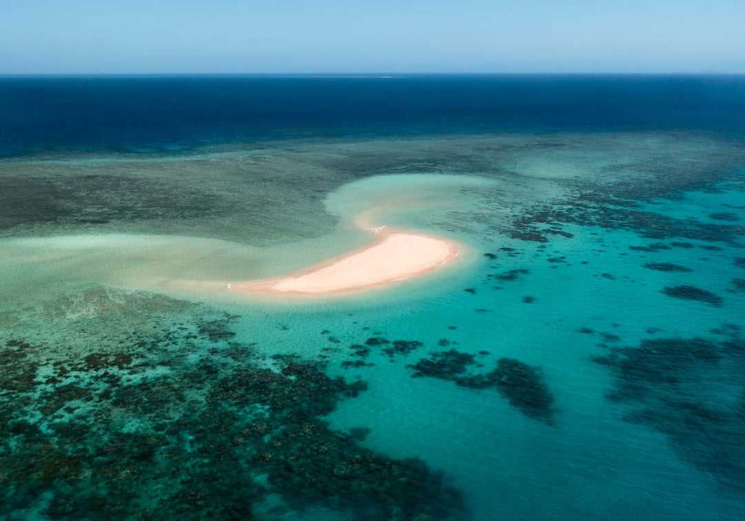 Nothing But Blue Skies – Aerial photograph of Mackay Cay with pristine sand, turquoise waters, and coral patterns | Unframed Rolled Print