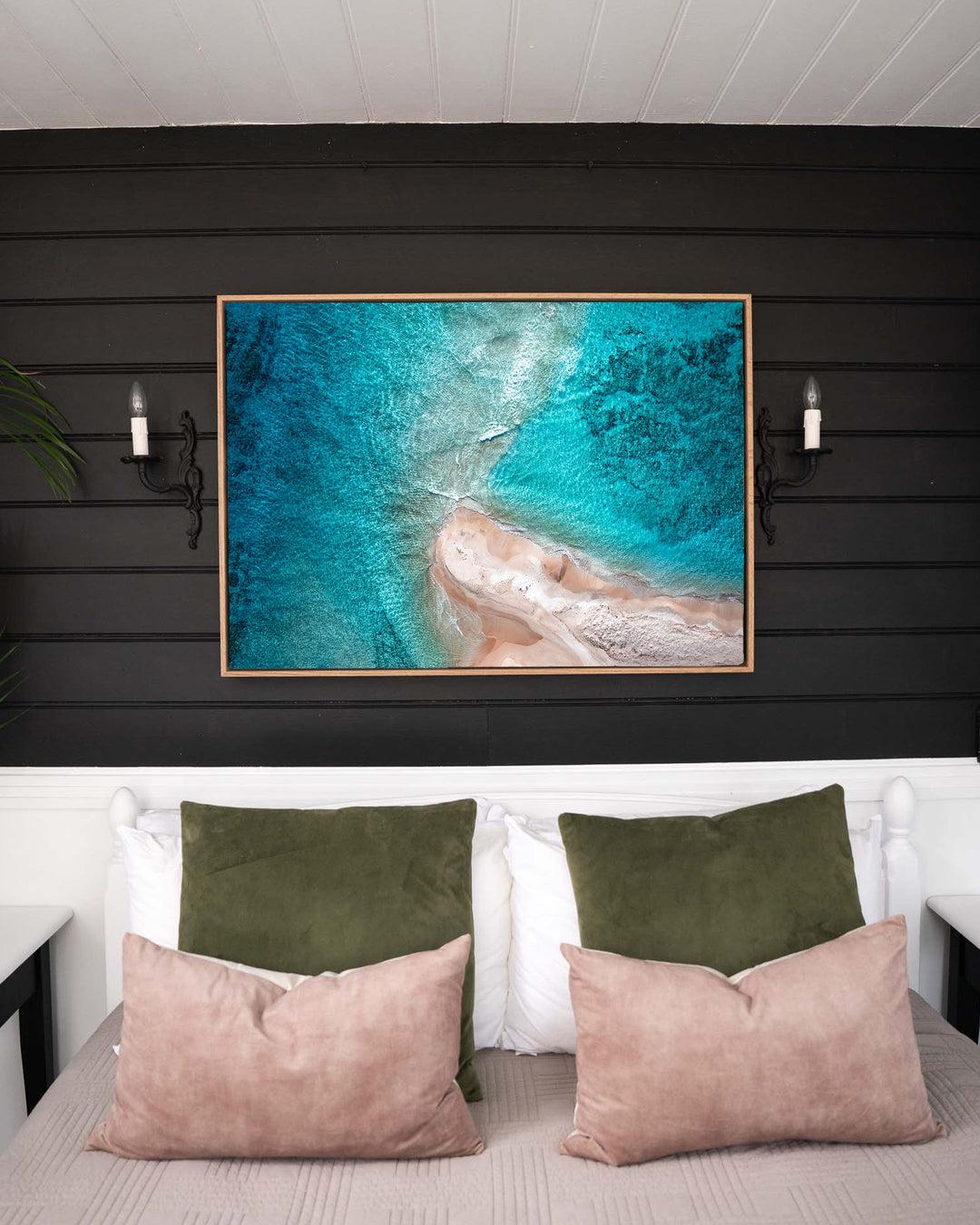 Nothing but Footprints – Ocean Art, Aerial Photography by David Lloyd, framed canvas print in oak float frame, styled in a bedroom setting