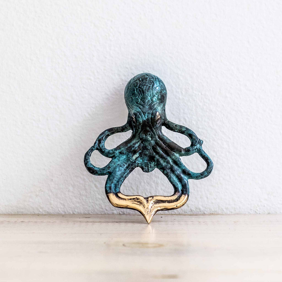 SEA Gallery Octopus Bottle Opener crafted in aged brass with intricate detailing and coastal-inspired design.